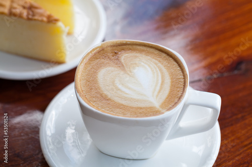 Photo: Cup of latte coffee with cake Cup of latte coffee with cake