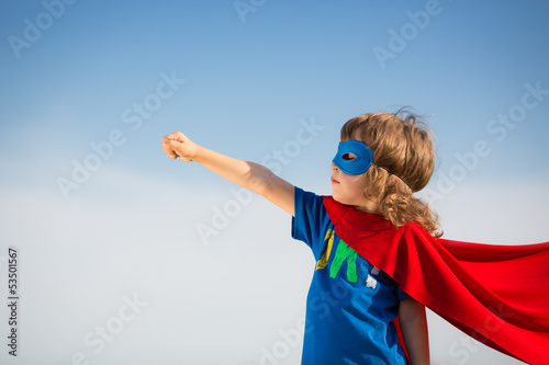 Photo: Superhero kid. Girl power concept Superhero kid. Girl power concept