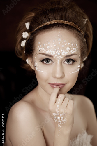 Photo: Woman with creative make-up of pearls Woman with creative make-up of pearls