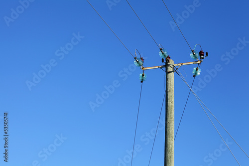 Photo: Powerline on wooden pillar Powerline on wooden pillar