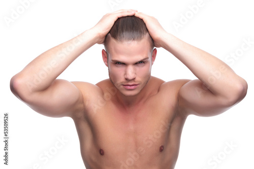 Photo: topless fashion man with hands on head topless fashion man with hands on head