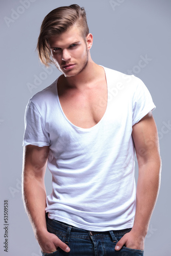 Photo: fashion man with both hands in pockets fashion man with both hands in pockets