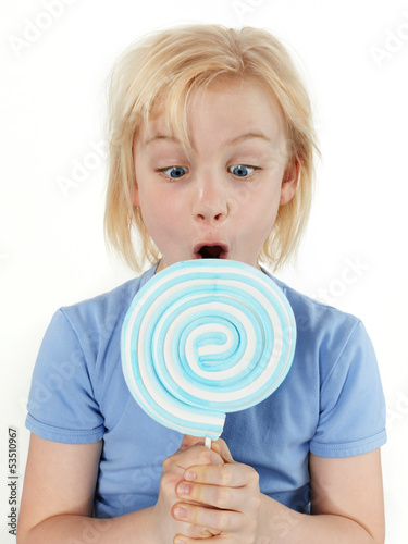 Photo: Girl is suprised about the size of the lollypop Girl is suprised about the size of the lollypop