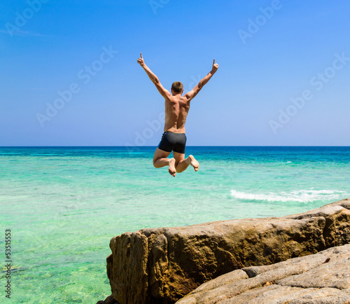 Photo: Man jumping in the sea Man jumping in the sea