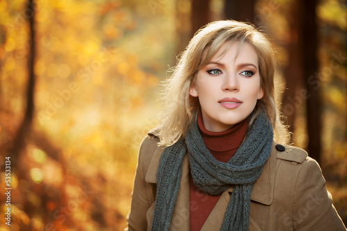Photo: Blond woman in autumn forest Blond woman in autumn forest