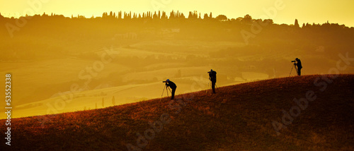 Photo: Val d'Orcia after sunrise with photographer, Tuscany, Italy Val d'Orcia after sunrise with photographer, Tuscany, Italy