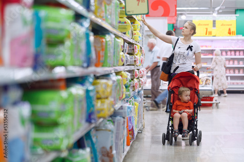 Photo: Mother with her boy in the supermarket Mother with her boy in the supermarket