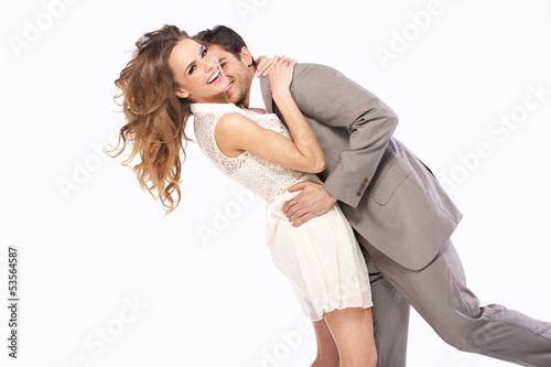 Photo: Delighted couple hugging each other Delighted couple hugging each other