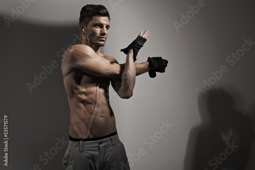 Photo: Handsome well built man preparing to training Handsome well built man preparing to training