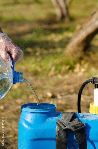 Photo: Filling a pesticide sprayer Filling a pesticide sprayer