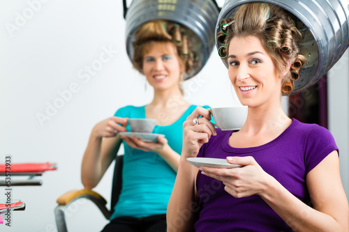 Photo: Women at the hairdresser hair being dried Women at the hairdresser hair being dried