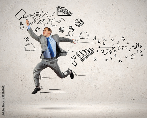 Photo: Jumping young businessman Jumping young businessman