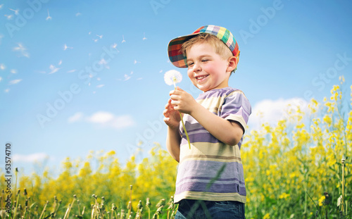 Photo: Colorful picture of child playing dandelion Colorful picture of child playing dandelion