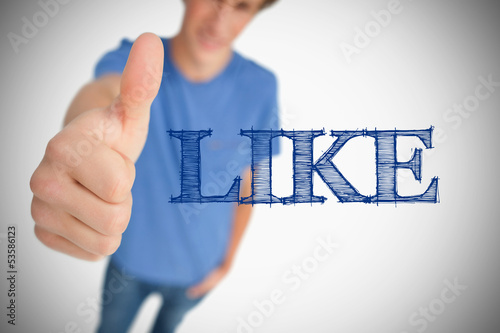 Photo: Boy representing social network logo with his thumb up Boy representing social network logo with his thumb up