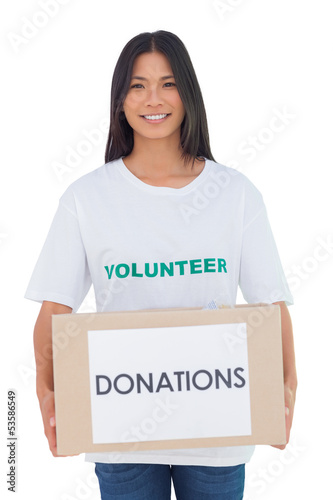 Photo: Smiling volunteer holding a donation box Smiling volunteer holding a donation box