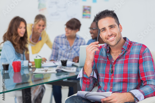 Photo: Handsome designer sit in his office Handsome designer sit in his office