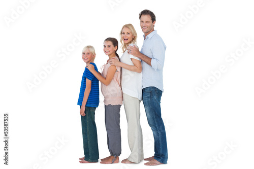 Photo: Family posing together and looking at camera Family posing together and looking at camera