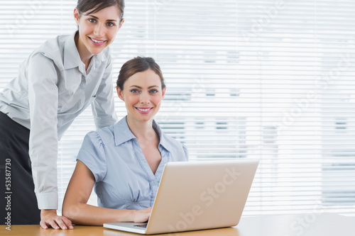 Photo: Businesswomen smiling at the camera Businesswomen smiling at the camera