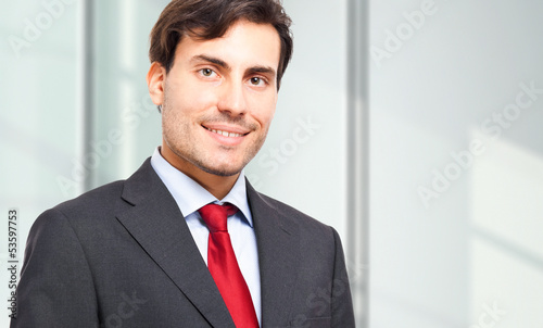 Photo: Young businessman in his office Young businessman in his office