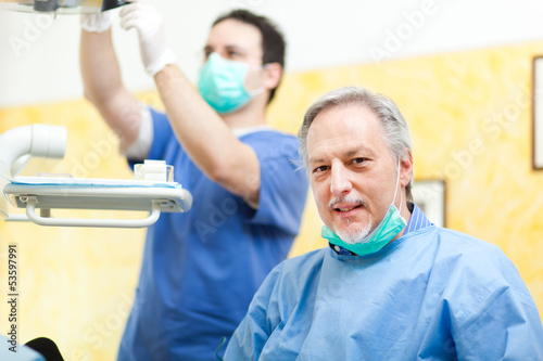 Photo: A dentist and his assistant in the studio A dentist and his assistant in the studio