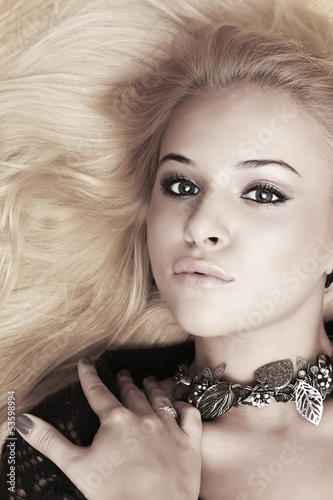 Photo: Beautiful blond woman. close-up portrait Beautiful blond woman. close-up portrait