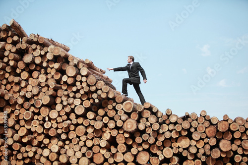 Photo: Young business man on his way to the top Young business man on his way to the top