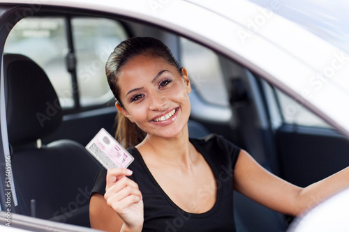 Photo: young woman just got her driving licence young woman just got her driving licence