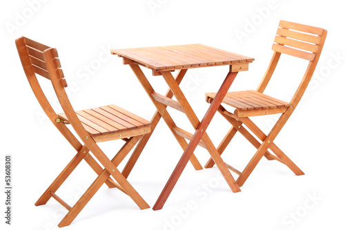 Photo: Wooden table with chairs isolated on white Wooden table with chairs isolated on white