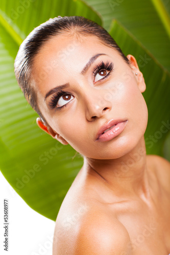 Photo: beauty woman posing on green leaf background beauty woman posing on green leaf background