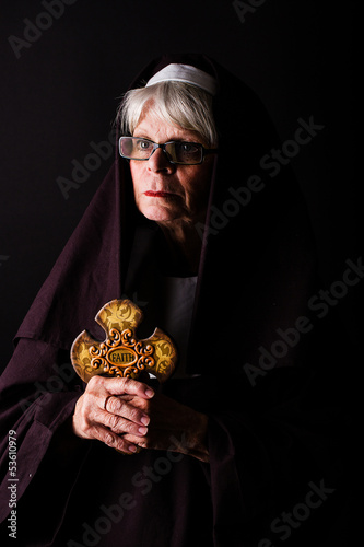 Photo: nun holding a cross nun holding a cross