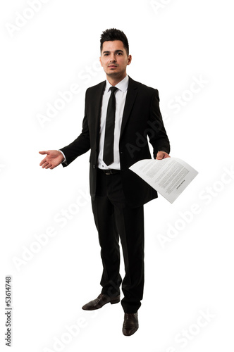 Photo: Tall businessman waiting for a client to sign a contract Tall businessman waiting for a client to sign a contract