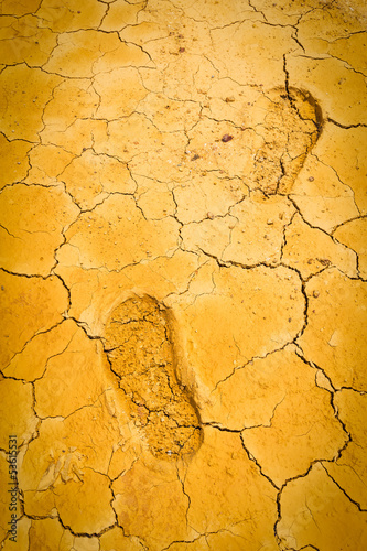 Photo: footprint on dry crack soil footprint on dry crack soil