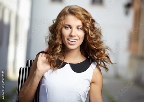 Photo: Young fashion woman in old city Young fashion woman in old city