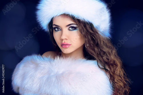 Photo: Beautiful Girl in Fur Coat and Furry Hat. Fashion Model. Winter Beautiful Girl in Fur Coat and Furry Hat. Fashion Model. Winter