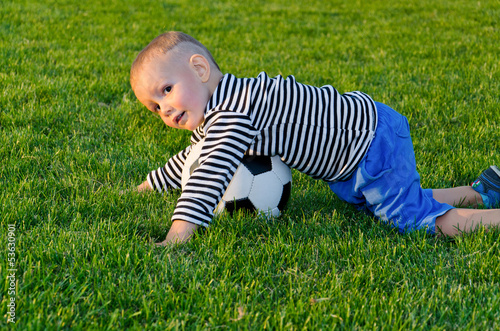 Photo: Small boy playing soccer Small boy playing soccer