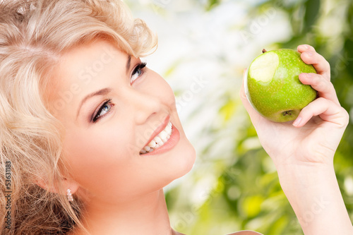 Photo: young beautiful woman with green apple young beautiful woman with green apple