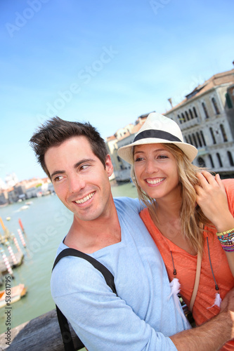 Photo: Couple standing on the Academia Bridge in Venice, Italy Couple standing on the Academia Bridge in Venice, Italy