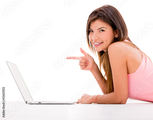 Photo: Woman pointing at a laptop Woman pointing at a laptop