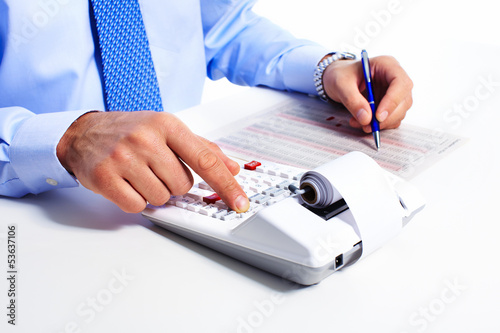 Photo: Hand with calculator. Hand with calculator.
