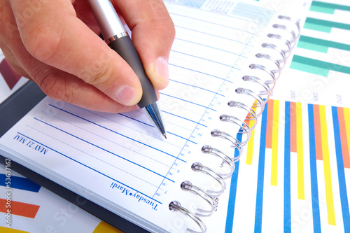 Photo: Writing business people. Writing business people.