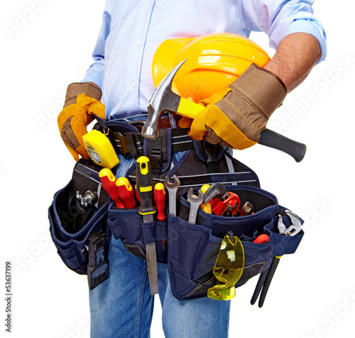Photo: Worker with a tool belt. Construction. Worker with a tool belt. Construction.