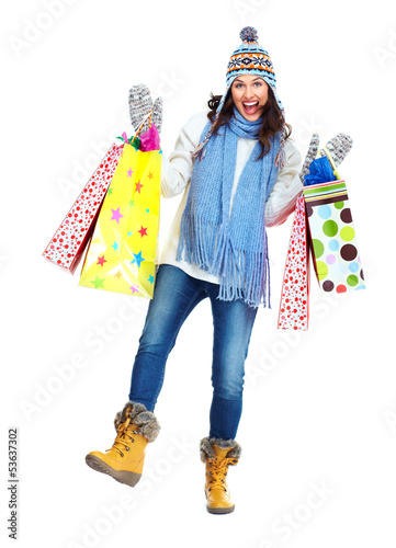 Photo: Beautiful shopping Christmas woman with bags. Beautiful shopping Christmas woman with bags.