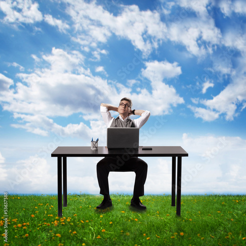Photo: Businessman relaxing in the office. Businessman relaxing in the office.
