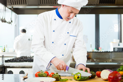 Photo: Chef cooking in his kitchen Chef cooking in his kitchen