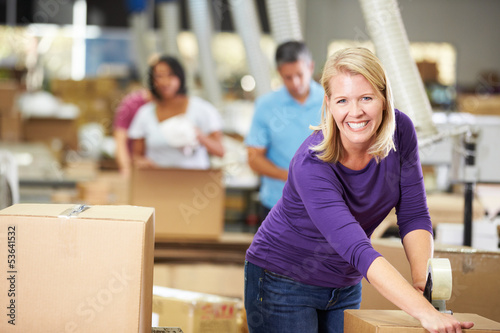 Photo: Workers In Warehouse Preparing Goods For Dispatch Workers In Warehouse Preparing Goods For Dispatch