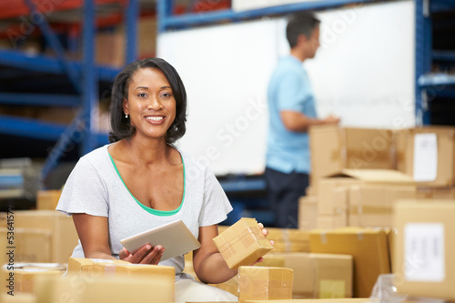 Photo: Workers In Warehouse Preparing Goods For Dispatch Workers In Warehouse Preparing Goods For Dispatch