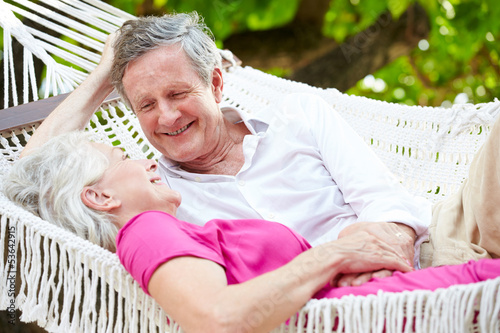 Photo: Senior Couple Relaxing In Beach Hammock Senior Couple Relaxing In Beach Hammock