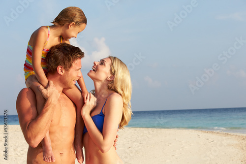 Photo: Family On Tropical Beach Holiday Family On Tropical Beach Holiday