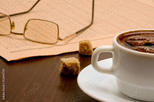 Photo: Cup of coffee and newspaper Cup of coffee and newspaper