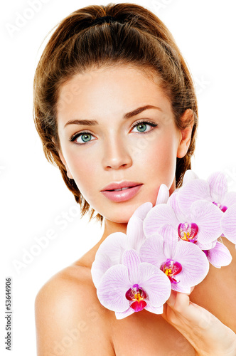 Photo: beautiful woman with pink orchid beautiful woman with pink orchid